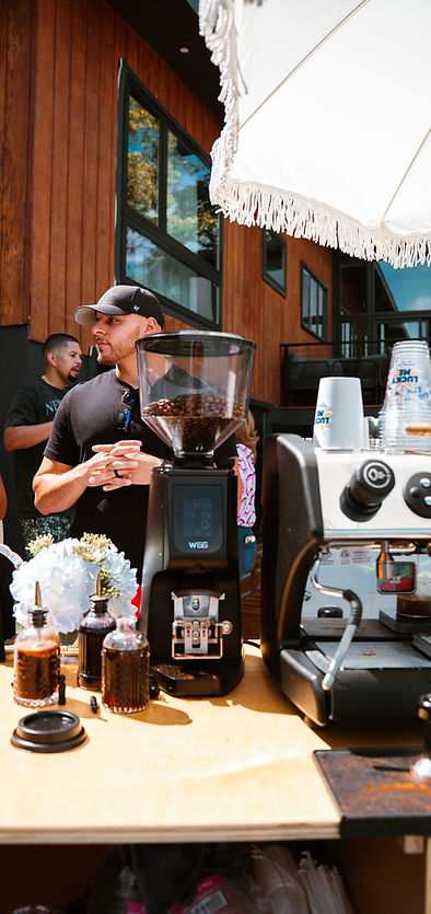 Barista serving specialty coffee to guests at NYC brand activation event