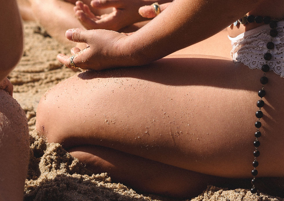 girl meditating at the beach