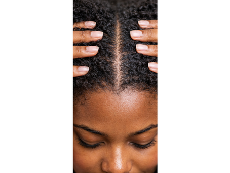 woman massaging her scalp