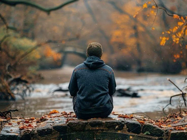 a man sitting alone in the garden