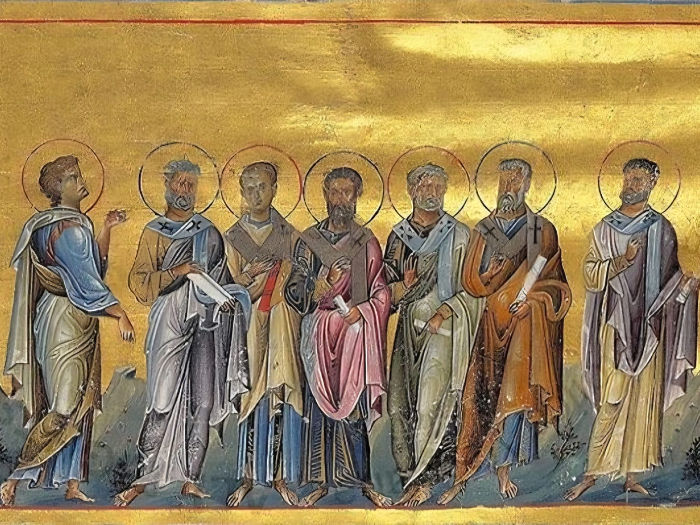 Ancient artwork shows seven haloed figures in colorful robes on a gold background, standing together with calm expressions.