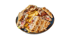 Greek chicken gyros pita club with chips, fresh salad and tzatziki on a blue plate