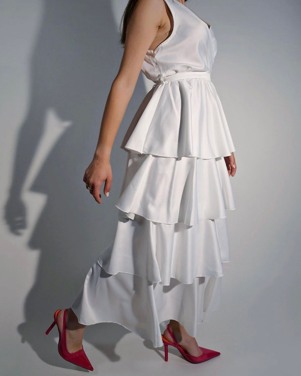 White tiered skirt and pink high heels