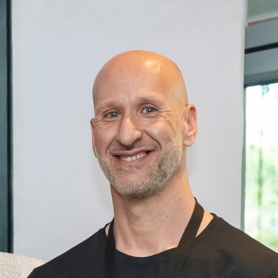 Headshot of George Polyzos, Vice President for Asia Pacific & Japan at Celigo, featured as a testimonial on Stirling Marketing’s home page