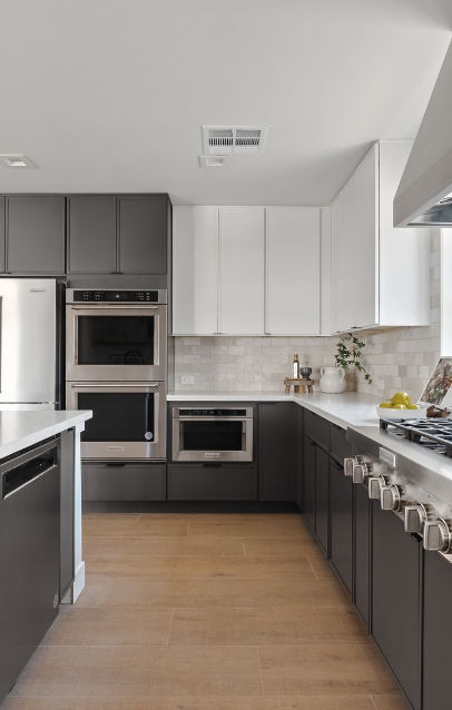 Gray and white marble kitchen interior featuring built-in oven and fridge - elegant Arizona home design by Pediment & Pillar Design.