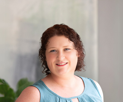 Cally Sullivan, founder of Inverted Dawn Counseling, in a blue top