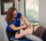 Dr. Erienne Blanchard providing hands-on manual therapy for neck pain in Gainesville FL.