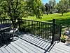 Deck Construction by 5 Star Decks overlooking a backyard