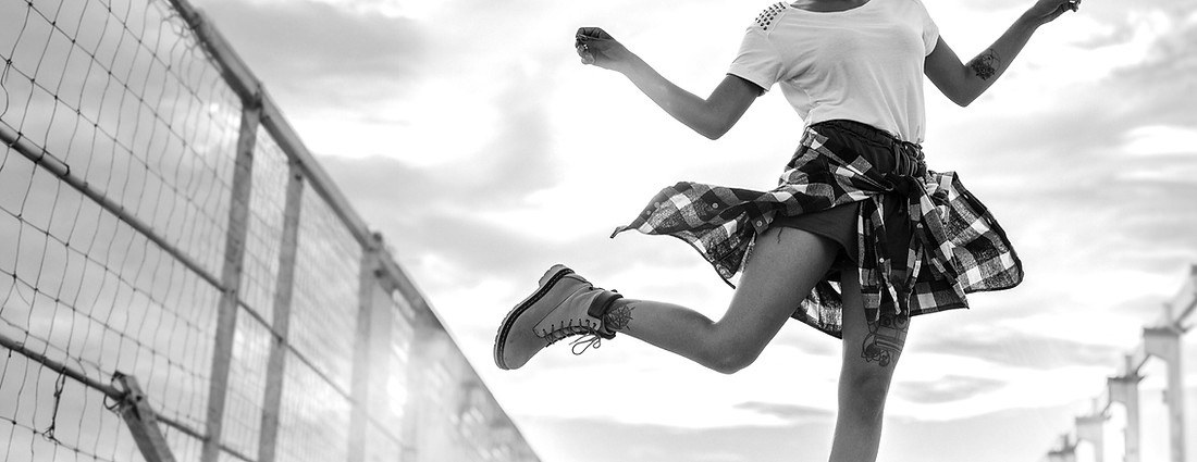black woman kicking up dust