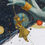 Thumbnail: Golden thread and puppet detail from Genesis painting