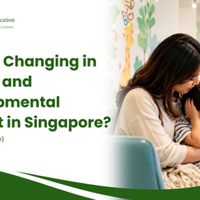 A mother comforting a child covering his ears in a paediatric clinic waiting room, illustrating the need for accessible speech and developmental support discussed by Total Communication Singapore.