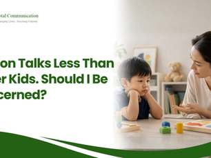 A child engaging in a communication activity with a parent, representing speech and developmental support at Total Communication Therapy in Singapore.