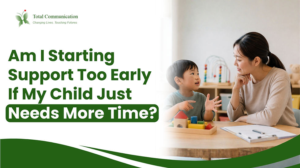Parent listening attentively as a young child communicates through gestures during play in a warm, supportive indoor setting.
