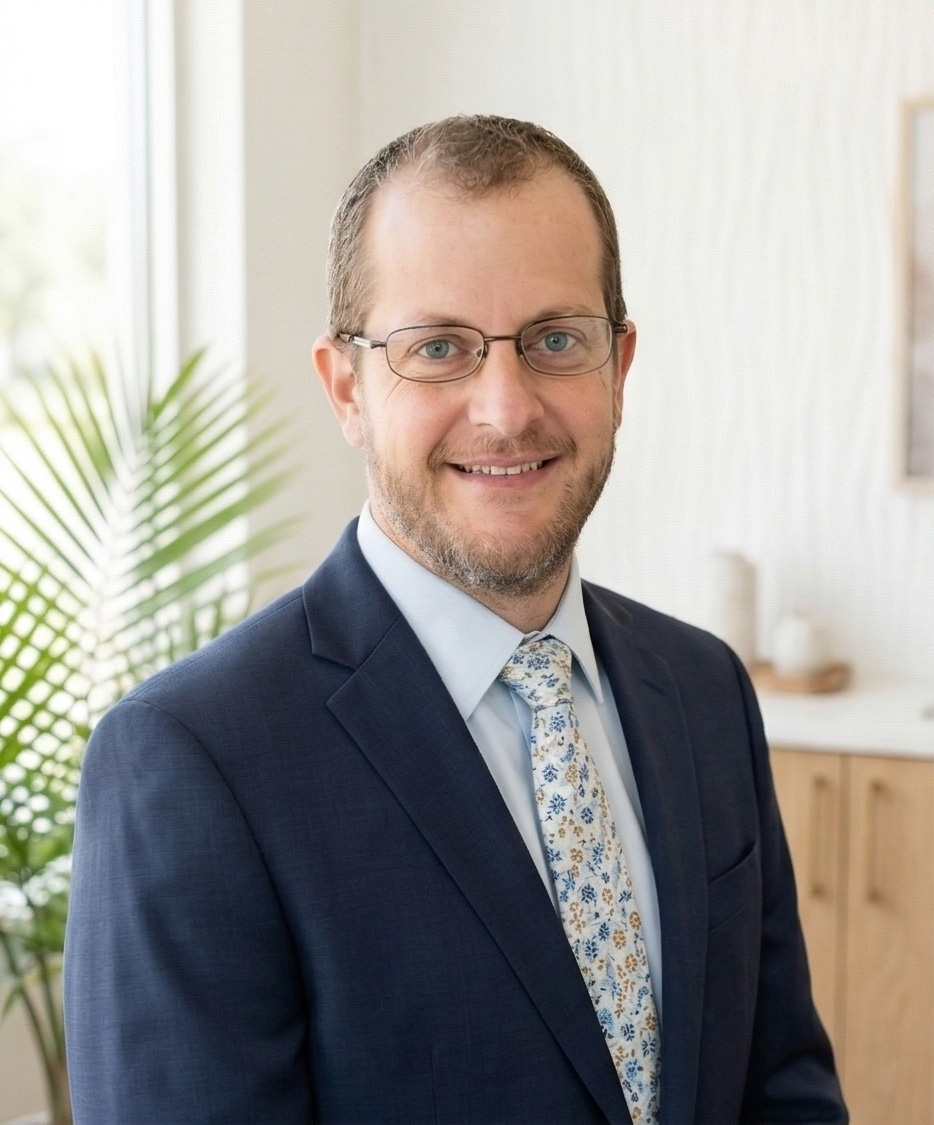 Dr. Matthew Burry, Yale and Columbia-trained board-certified neurosurgeon at Pure Renewal, expert in spinal surgery and nerve root injury treatment.