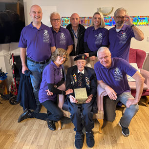 Taxi Charity volunteers honour WWII veteran John King at 101st birthday