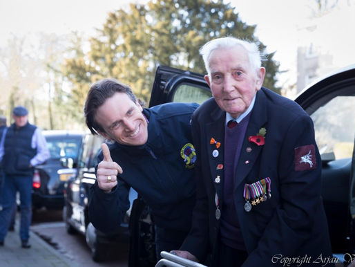 WWII veteran Ray Whitwell talks to Taxi Charity volunteer, Seb Philp