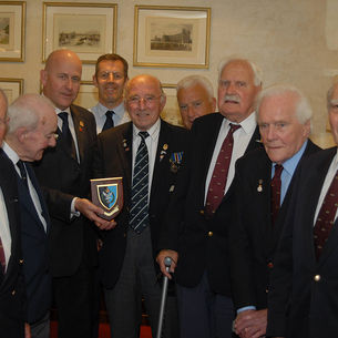 Taxi Charity presented with shield by The Glider Pilot Regiment Association
