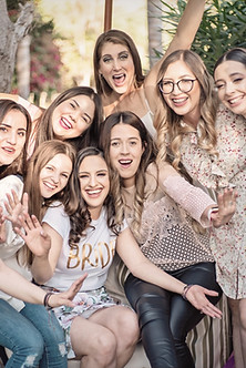 group of women taking picture during day