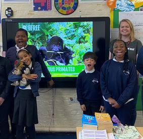 Children standing in front of whiteboard