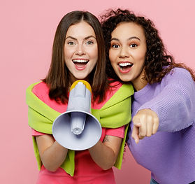 Young two friends women wears green purple shirts together hold scream in megaphone announ