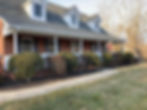 A beautiful house is showcased with newly installed gutters that complement its elegant exterior.
