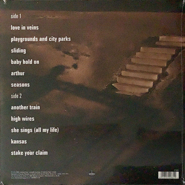 The Bodyguard album cover: song titles, sepia-toned staircase