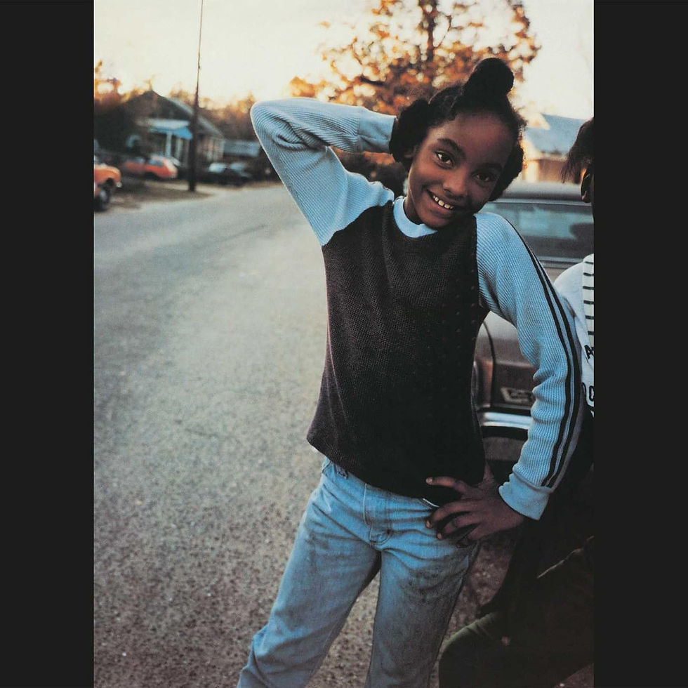 Smiling girl poses on residential street