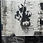 Thumbnail: Graffiti art: Figure with pole, text background