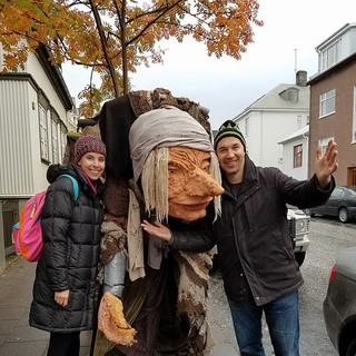 Christy and Eric posing with a giant old woman Troll in Reykjavik Iceland
