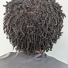 Shoulder length, dark, tight coily hair.