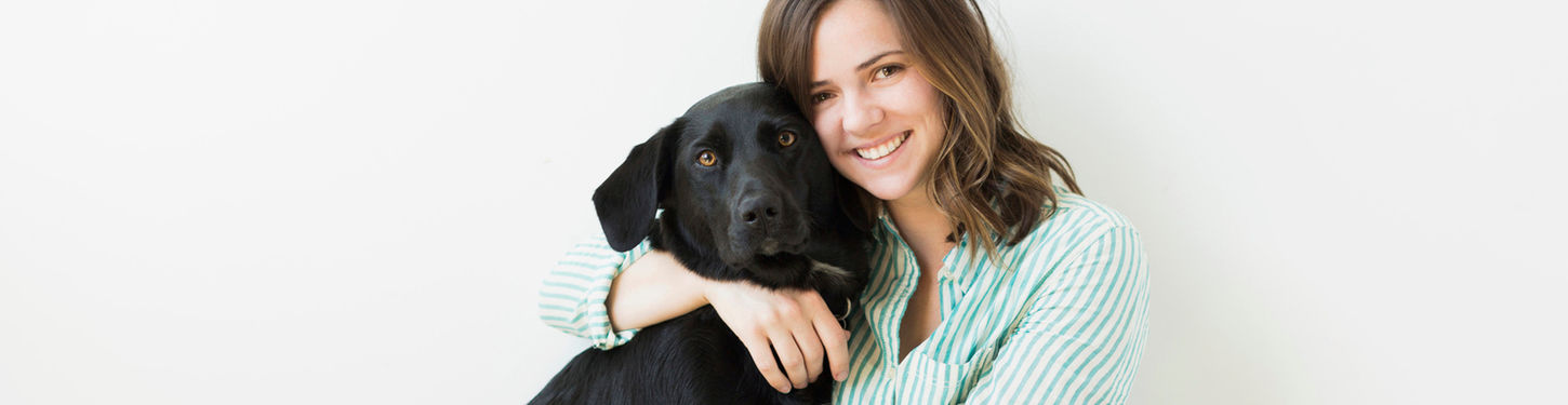 Girl Hugging her Dog