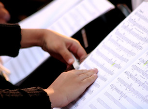 Someone Reading Sheet Music