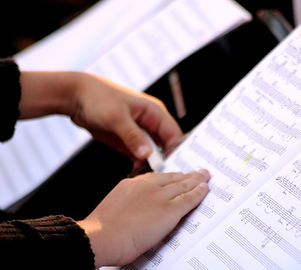 Someone Reading Sheet Music