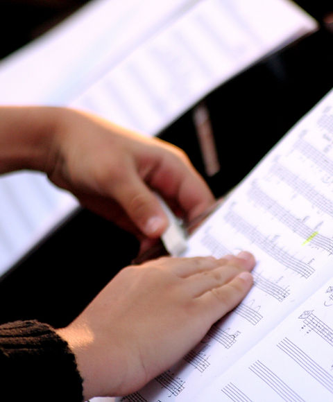 Someone Reading Sheet Music
