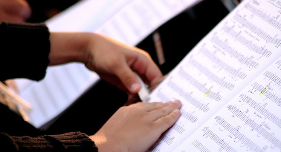 Someone Reading Sheet Music