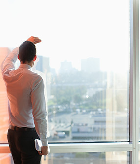 Man Looking Through a Window