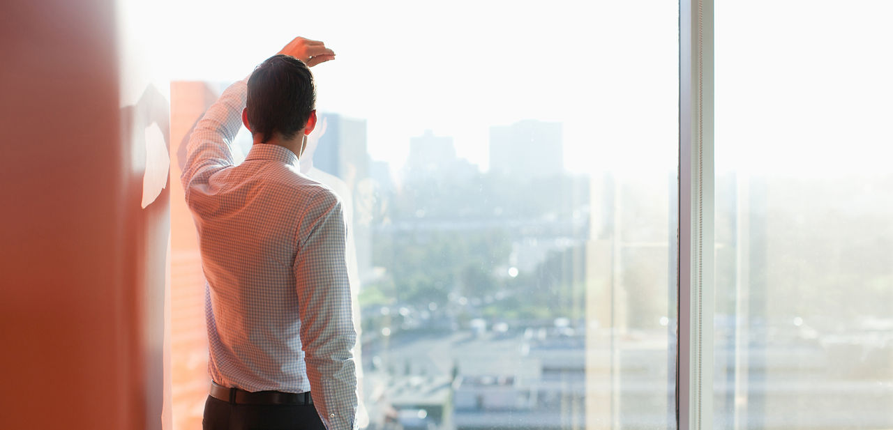 Man Looking Through a Window