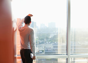 Man Looking Through a Window