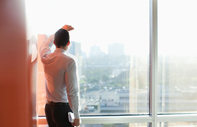 Man Looking Through a Window
