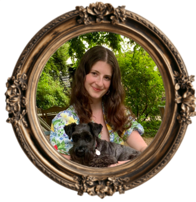 Young woman holding a black dog in an ornate frame