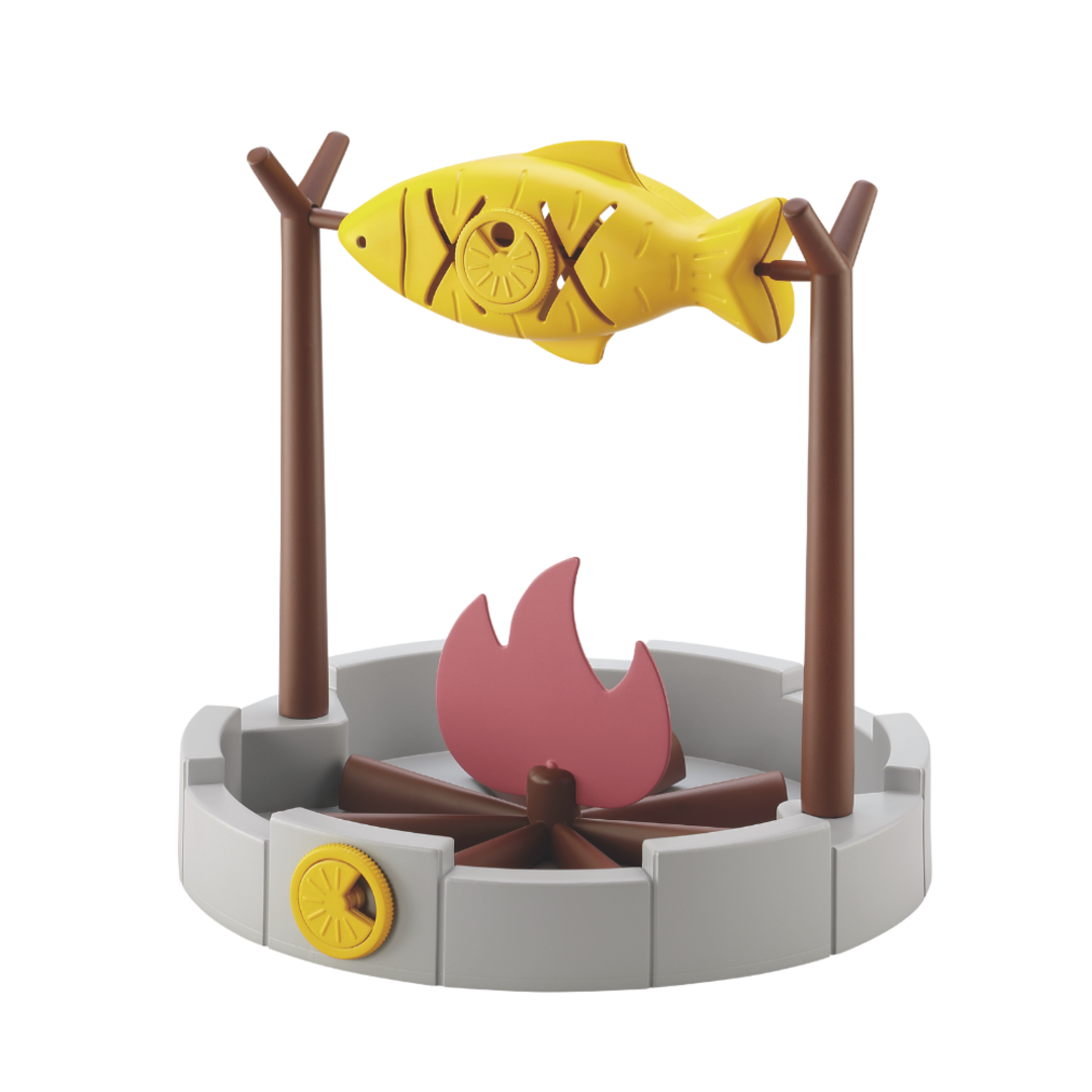 Cat playing with the PetPals® Grilled Fish Toy — a rotating slow feeder and treat dispenser.
