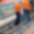 Two men working on railroad tracks
