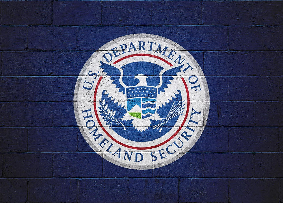 US Department of Homeland Security logo on a blue brick wall