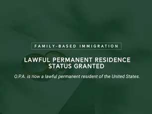 permanent residence application lying underneath a set of wedding rings