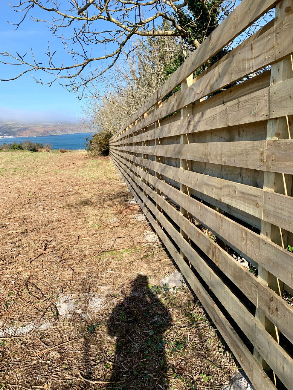 Horizontal timber fence installed along field boundary – JDM Building Services Isle of Man