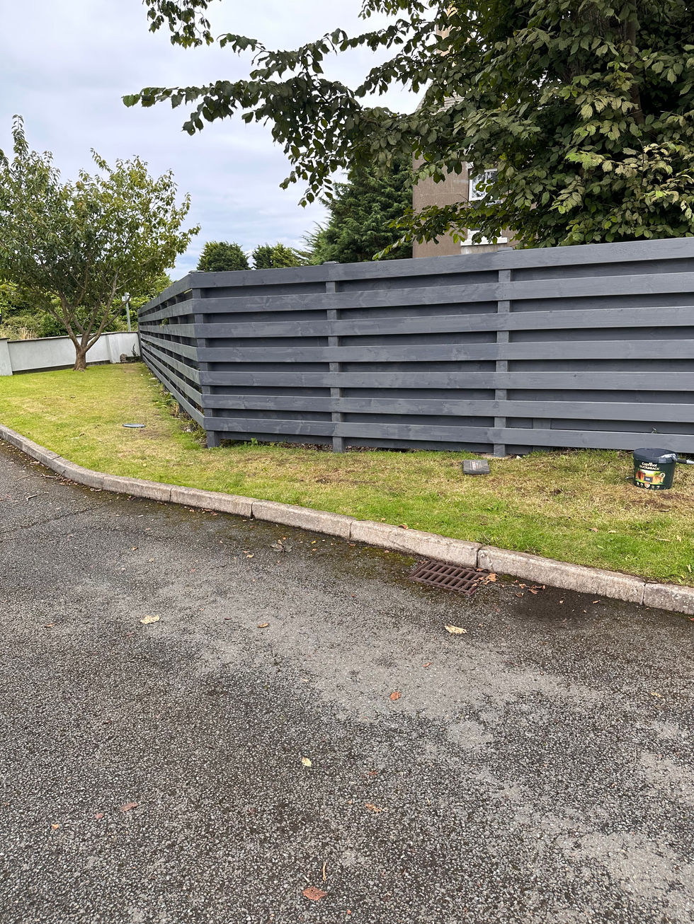 New grey horizontal-slat boundary fence installation – JDM Building Services Isle of Man