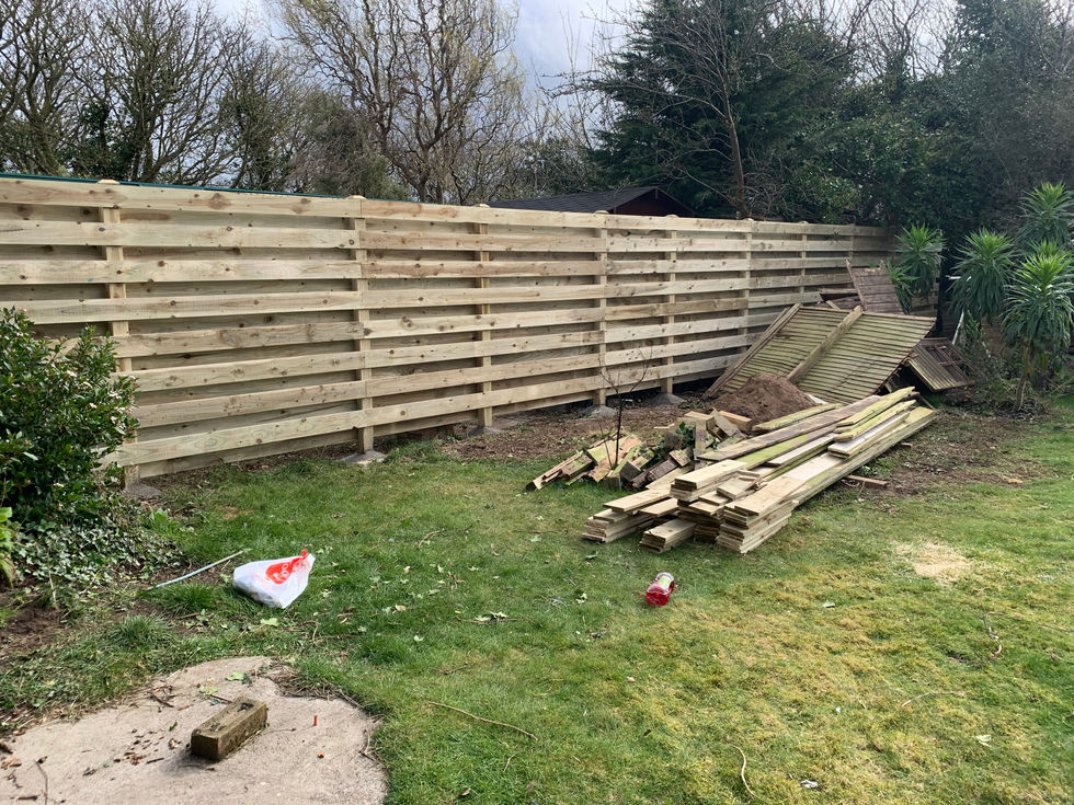 Extended horizontal timber boundary fence installation – JDM Building Services Isle of Man