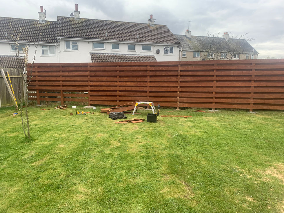 Completed horizontal timber fence across rear garden – JDM Building Services Isle of Man
