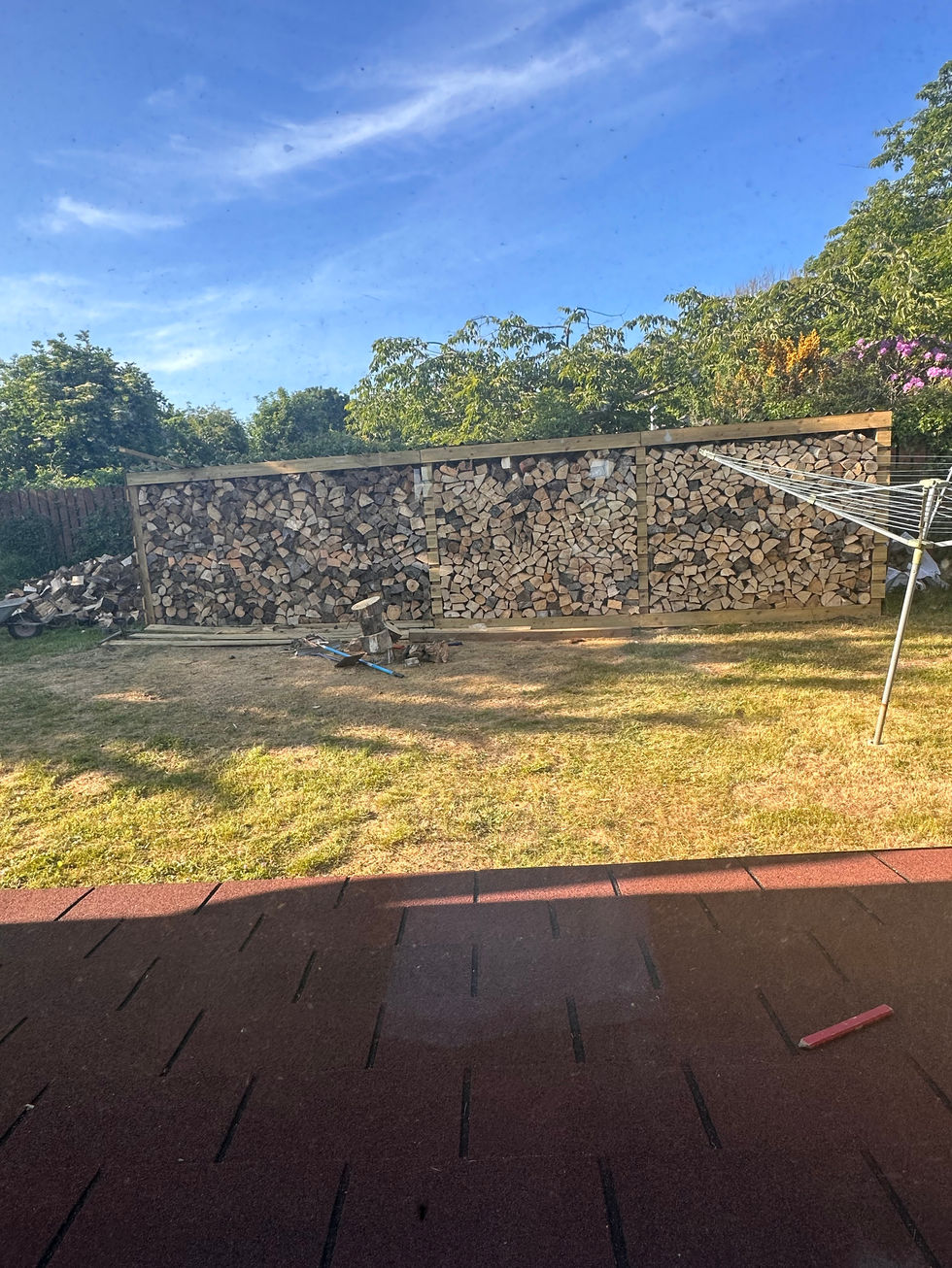 New wood shed installed with logs – JDM Building Services Isle of Man