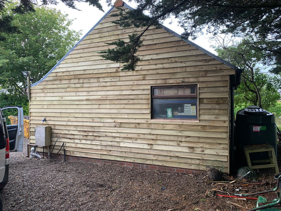 Exterior shed reclad with new horizontal timber boards – JDM Building Services Isle of Man